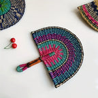 Teal and magenta woven straw hand fan