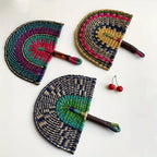 Three woven straw hand fans in Bolga style