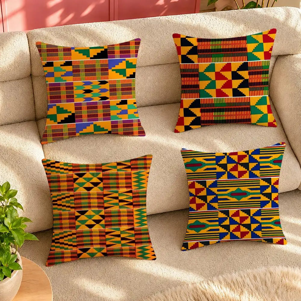 Four kente pattern cushion covers on a sofa