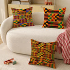Kente pattern throw pillows styled on a white sofa