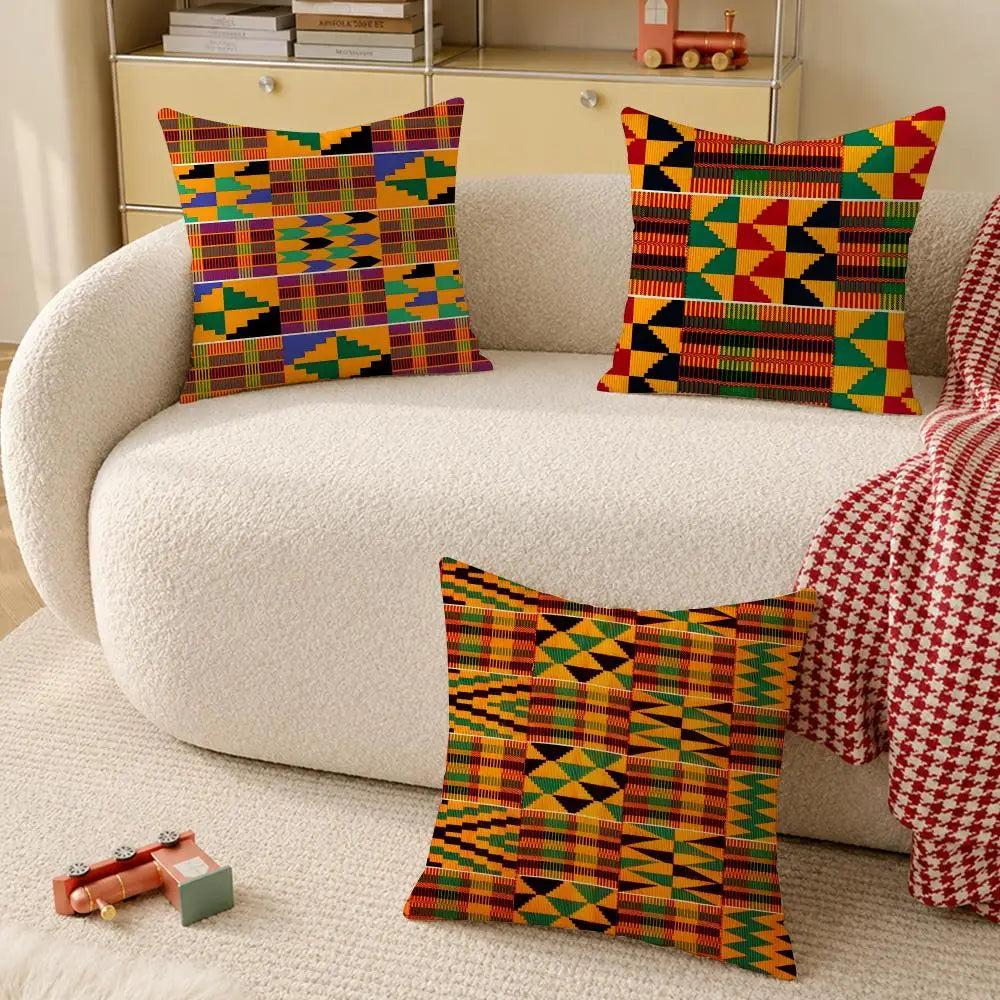 Kente pattern throw pillows styled on a white sofa